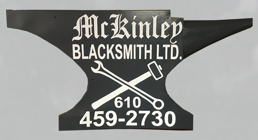 Here is the sign after I re-primed and painted it with an industrial steel paint, then hand lettered in white for that "old style effect" 